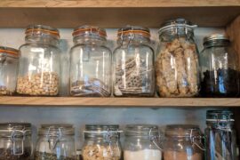 shelves with jars containing dried goods